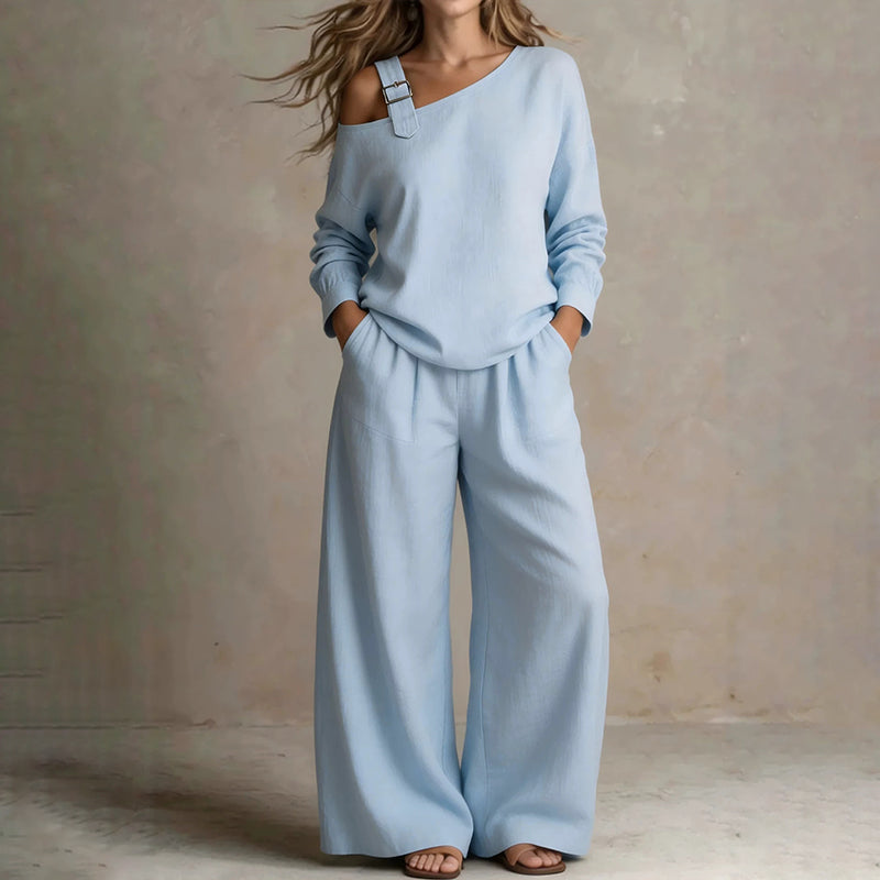 Conjunto elegante de top asimétrico y pantalón de pierna ancha para mujer.
