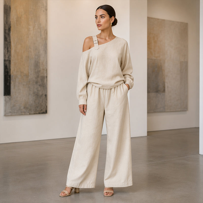 Conjunto elegante de top asimétrico y pantalón de pierna ancha para mujer.