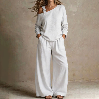 Conjunto elegante de top asimétrico y pantalón de pierna ancha para mujer.