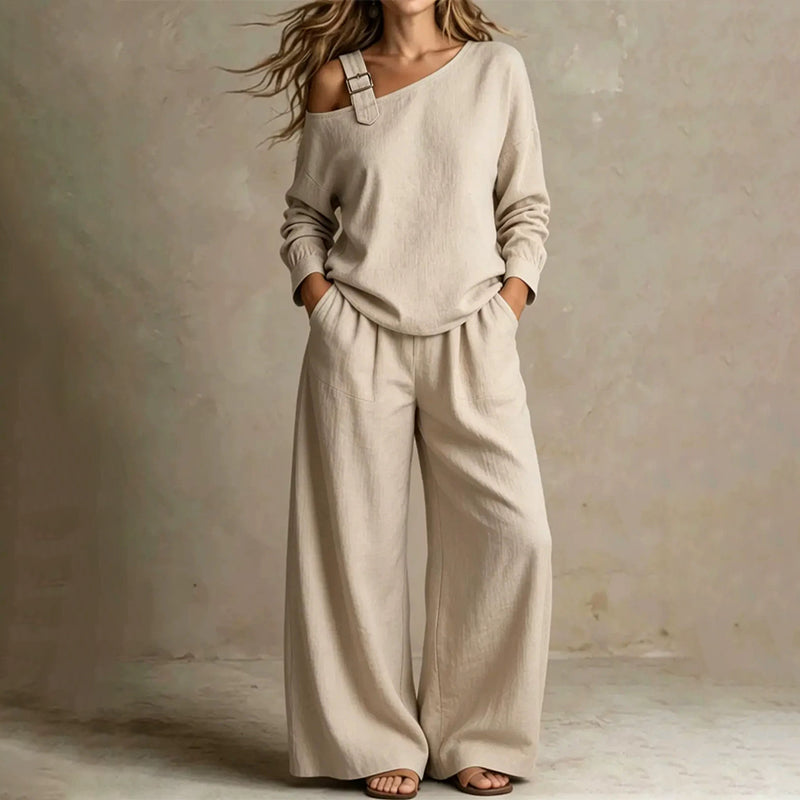 Conjunto elegante de top asimétrico y pantalón de pierna ancha para mujer.