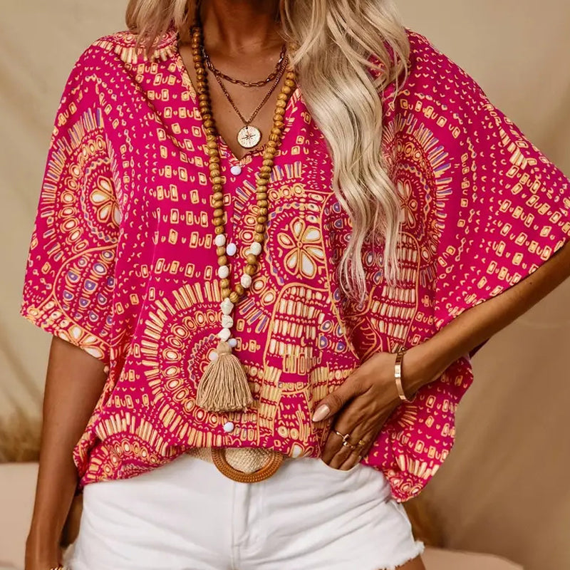 Top holgado de mujer con cuello en V y estampado, con mangas murciélago