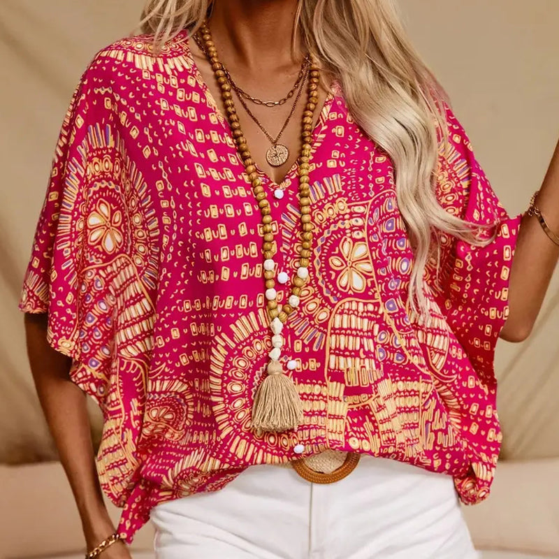 Top holgado de mujer con cuello en V y estampado, con mangas murciélago