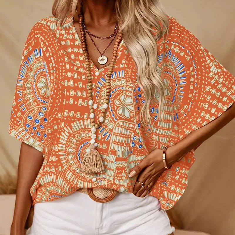 Top holgado de mujer con cuello en V y estampado, con mangas murciélago