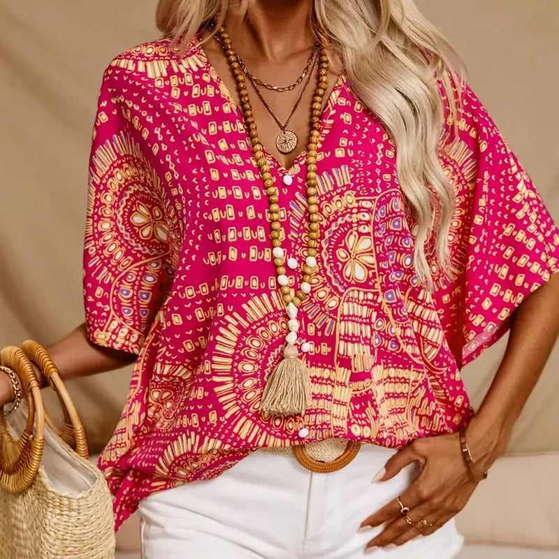 Top holgado de mujer con cuello en V y estampado, con mangas murciélago